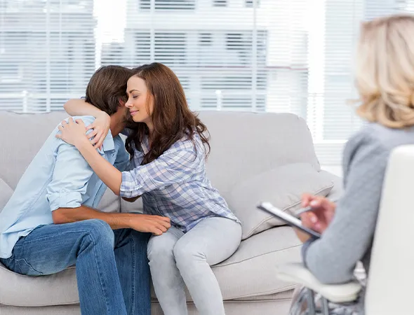 Couple working through a difficult conversation with a communication coach