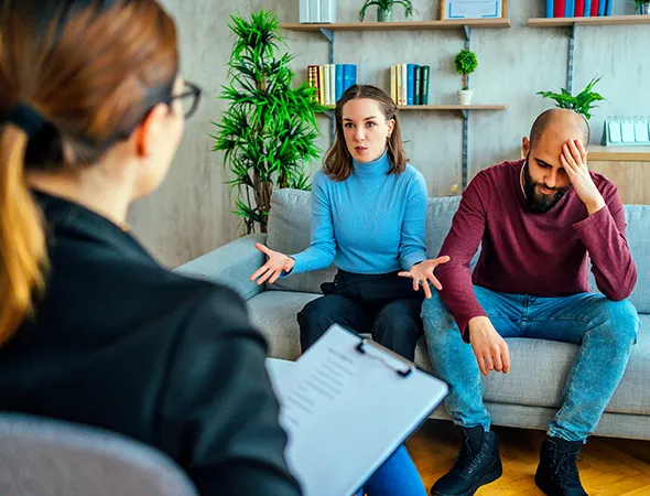 Engaged couple discussing marriage readiness during premarital coaching