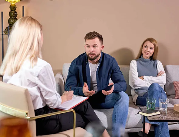 Coach guiding a couple through a relationship coaching session