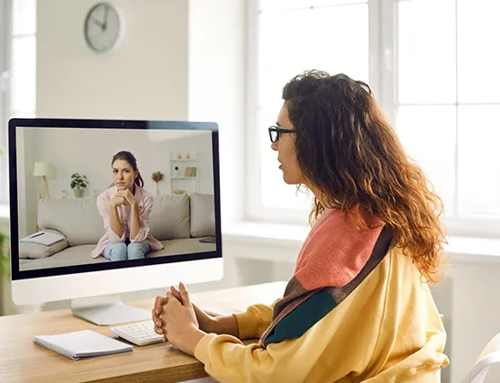 Couple attending a video-based online relationship coaching session